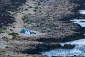 Tourist tent on the Mediterranean coast. photo