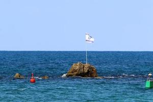 The blue and white Israeli flag with the Star of David. photo