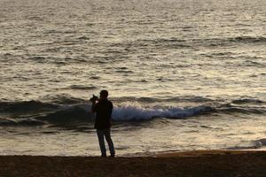 Nahariya Israel June 16, 2020. Man on vacation in a city park near the sea. photo