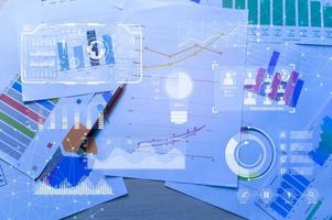 Background of documents with analytics data lying on table photo