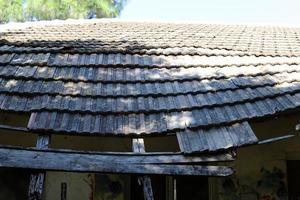 Leaky roof on an old village house. photo