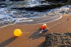 Balloons in a city park on the seashore. photo