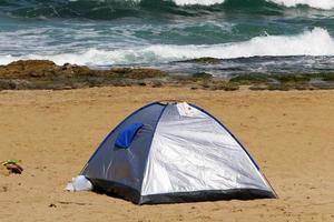 Tourist tent on the Mediterranean coast. photo