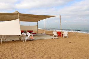 Tourist tent on the Mediterranean coast. photo