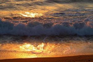 The sun sets below the horizon on the Mediterranean Sea in northern Israel. photo