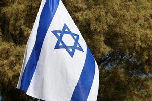 The blue and white Israeli flag with the Star of David. photo