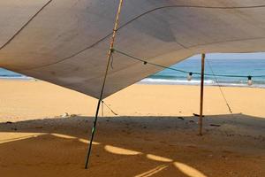 Tourist tent on the Mediterranean coast. photo