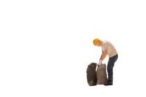 Miniature worker isolated on white background with clipping path photo