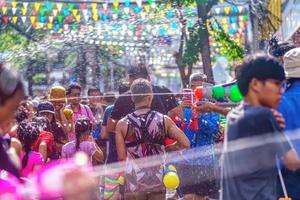 Siam Square, Bangkok, Thailand - APR 13, 2019 short action of people joins celebrations of the Thai New Year or Songkran in Siam Square. photo