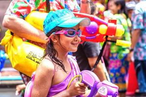 Siam Square, Bangkok, Thailand - APR 13, 2019 short action of people joins celebrations of the Thai New Year or Songkran in Siam Square. photo