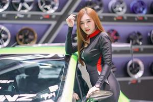 Nonthaburi, Thailand - DEC 3, 2019 Unidentified model poses with a car at The 36th Motor Expo Thailand 2019 at IMPACT Arena, Muang Thong Thani, Nonthaburi, Thailand. photo