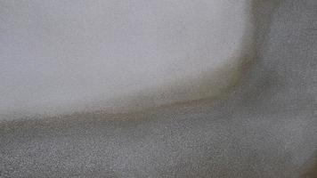 The old cement wall was weathered, the surface was scratched, the surface was scratched and damaged. For a mysterious retro-conservative background. photo