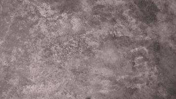 The old cement wall was weathered, the surface was scratched, the surface was scratched and damaged. For a mysterious retro-conservative background. photo