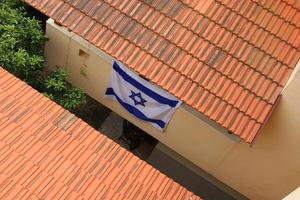 The blue and white Israeli flag with the Star of David. photo