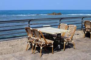 Chair for relaxing in a cafe on the Mediterranean coast photo