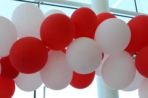 Balloons in a city park on the seashore. photo