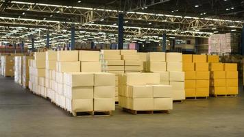 Inventory full of cardboard boxes in modern warehouse storage of retail shop. photo