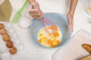 Close up of Young beautiful woman is baking in her kitchen , bakery and coffee shop business photo