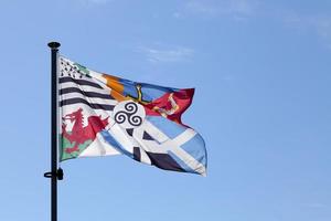 Interceltic flag waving in mid air photo