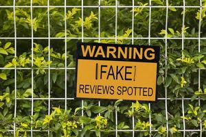 Warning, Fake reviews spotted sign photo