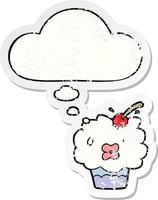 cartoon cupcake and thought bubble as a distressed worn sticker vector