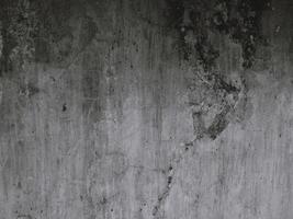 Black and white background image, rough surface, looks like a cement floor. photo