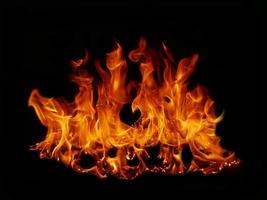 Flame Flame Texture For Strange Shape Fire Background Flame meat that is burned from the stove or from cooking. danger feeling abstract black background Suitable for banners or advertisements. photo