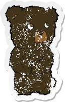 retro distressed sticker of a cartoon black bear cub vector