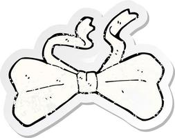 retro distressed sticker of a cartoon bow tie vector