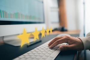 Hand and Phone With Five Star Rating photo