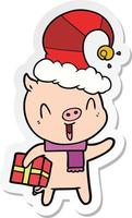 sticker of a happy cartoon pig with xmas present vector