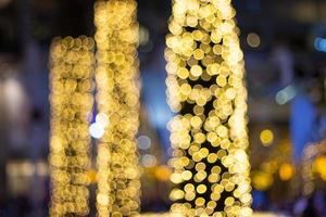 Blurred string led lights on tree in the garden at night time used for decorating for beauty According to important festivals photo