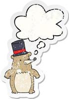 cartoon bear in top hat and thought bubble as a distressed worn sticker vector