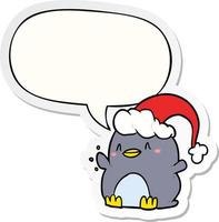 cartoon penguin wearing christmas hat and speech bubble sticker vector