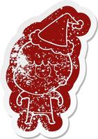 cartoon distressed sticker of a curious boy wearing santa hat vector