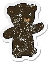 retro distressed sticker of a cartoon black bear cub vector