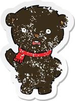 retro distressed sticker of a cartoon black bear wearing scarf vector