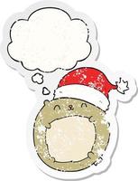 cute cartoon christmas bear and thought bubble as a distressed worn sticker vector