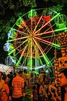 Bangkok Thailand - 26 November 2015 Unacquainted Thailand people or tourist walking and Local Ferris wheel in Loi Krathong Festival of  Wat Saket Temple.Bangkok city Thailand photo