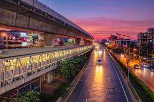 Beautiful Sunset sky with Traffic near BTS in the bangkok City photo