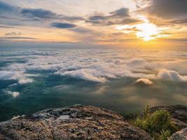 Beautiful Sunrise Sky with Sea of the mist of fog in the morning on Khao Luang mountain in Ramkhamhaeng National Park,Sukhothai province Thailand photo