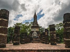 Ruin of ancient Statue in Wat mahathat Temple Area At sukhothai historical park,Sukhothai city Thailand photo