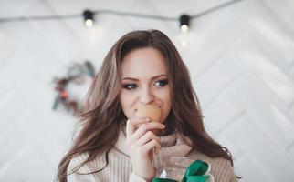 woman smelling a sweet cookie