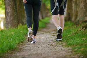 Young couple jogging at morning photo