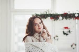 l woman in warm knitted clothes photo