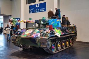 FRIEDRICHSHAFEN - MAY 2019 hippies on the tank painted with colors at Motorworld Classics Bodensee on May 11, 2019 in Friedrichshafen, Germany photo