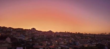 colorful late afternoon sunset in the countryside of Brazil photo