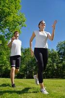 Young couple jogging at morning photo