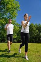 Young couple jogging at morning photo