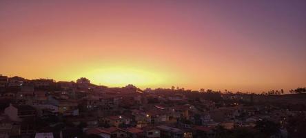 colorful late afternoon sunset in the countryside of Brazil photo